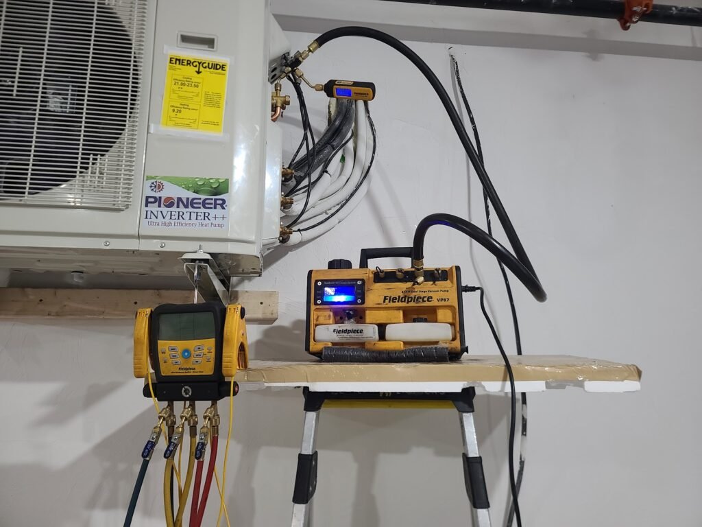 HVAC services system being vacuumed before refrigerant charge