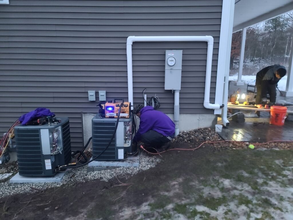 Technician Services working on outdoor HVAC unit