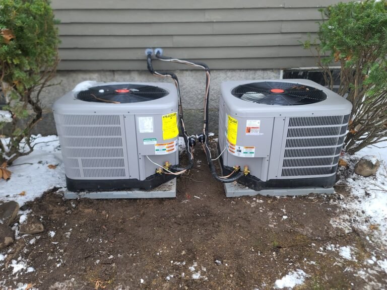 Technician performing final check on outside unit